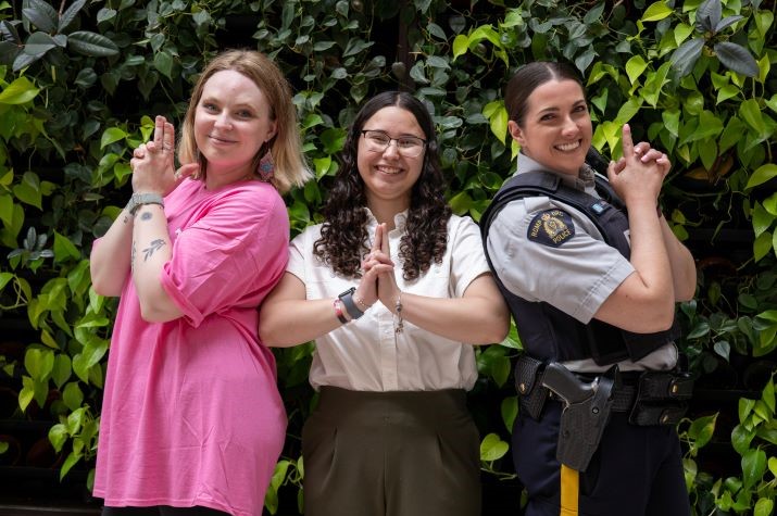 Three females - One is a youth, and one is a uniformed RCMP officer.