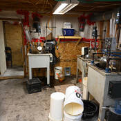 A clandestine synthetic drug lab was found in a hidden room underneath the garage.